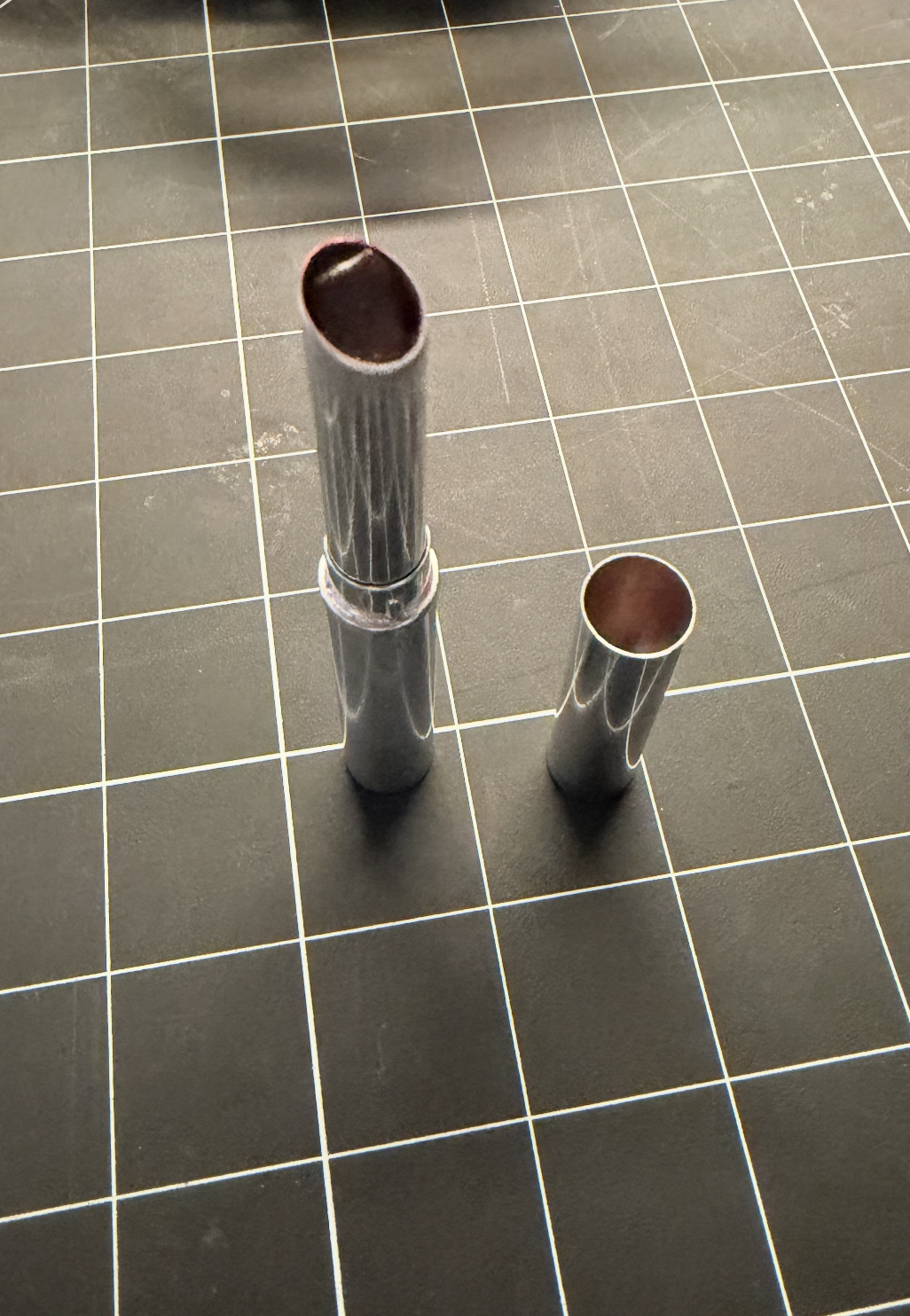 Lipstick with the cap off, diagonal view.